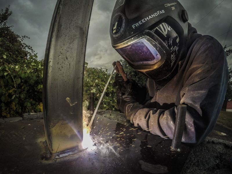 Welder working outdoors